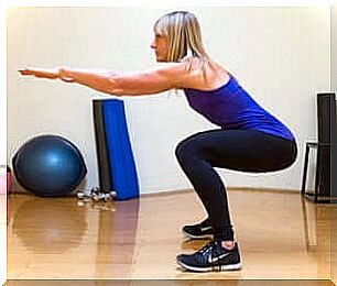 A woman doing squats. 