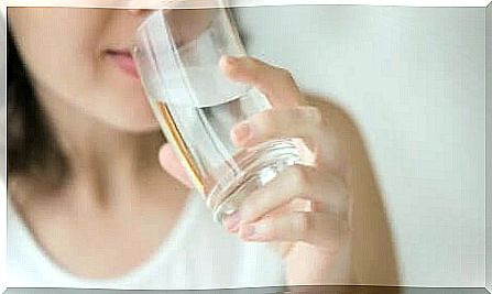 Woman drinking a glass of water 
