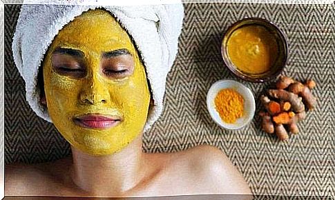 woman making turmeric mask to fight oily skin 