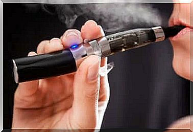 A person smoking an electronic cigarette.