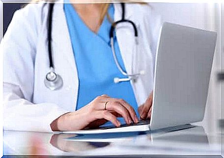 doctor with computer